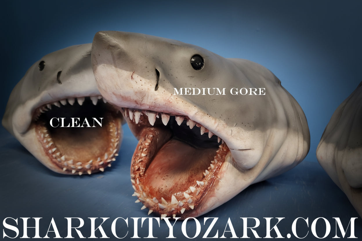 Two shark models with open mouths on a blue background, labeled 'Clean' and 'Medium Gore'. bruce jaws sark