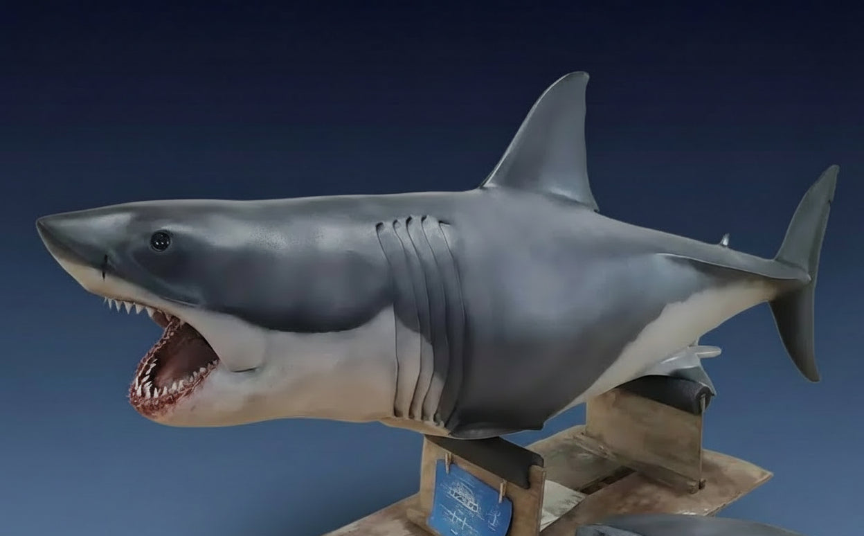 Shark model on a stand with 'Shark' branding