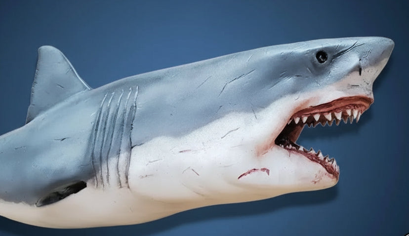 Model shark with open mouth on a white background. great white shark attack