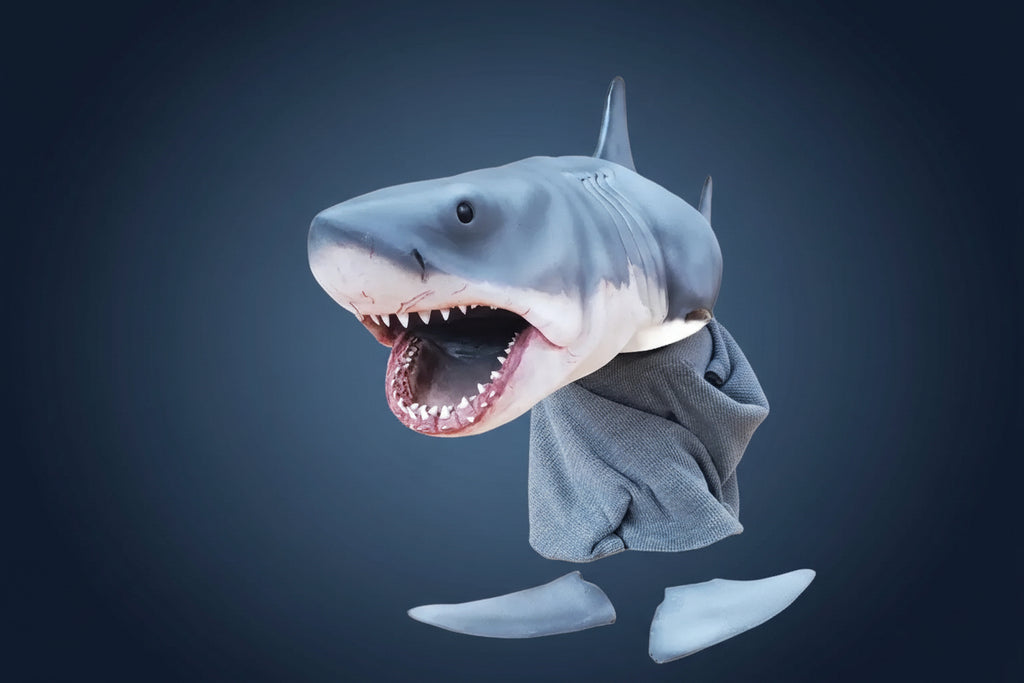 Shark costume with open mouth and gray pants on a white background. bruce jaws shark