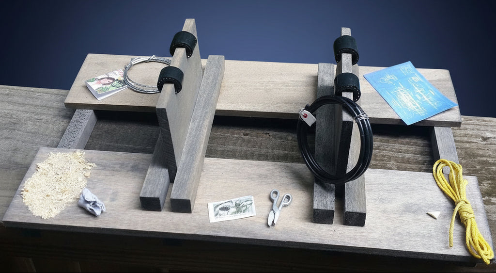 Wooden bench with tools and materials on a grassy background