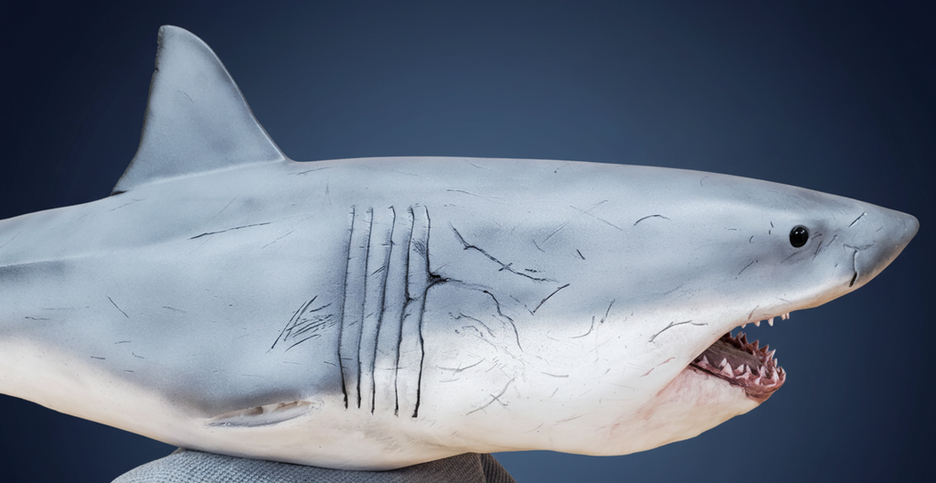 Shark sculpture with dark blue gradient background. great white shark attack